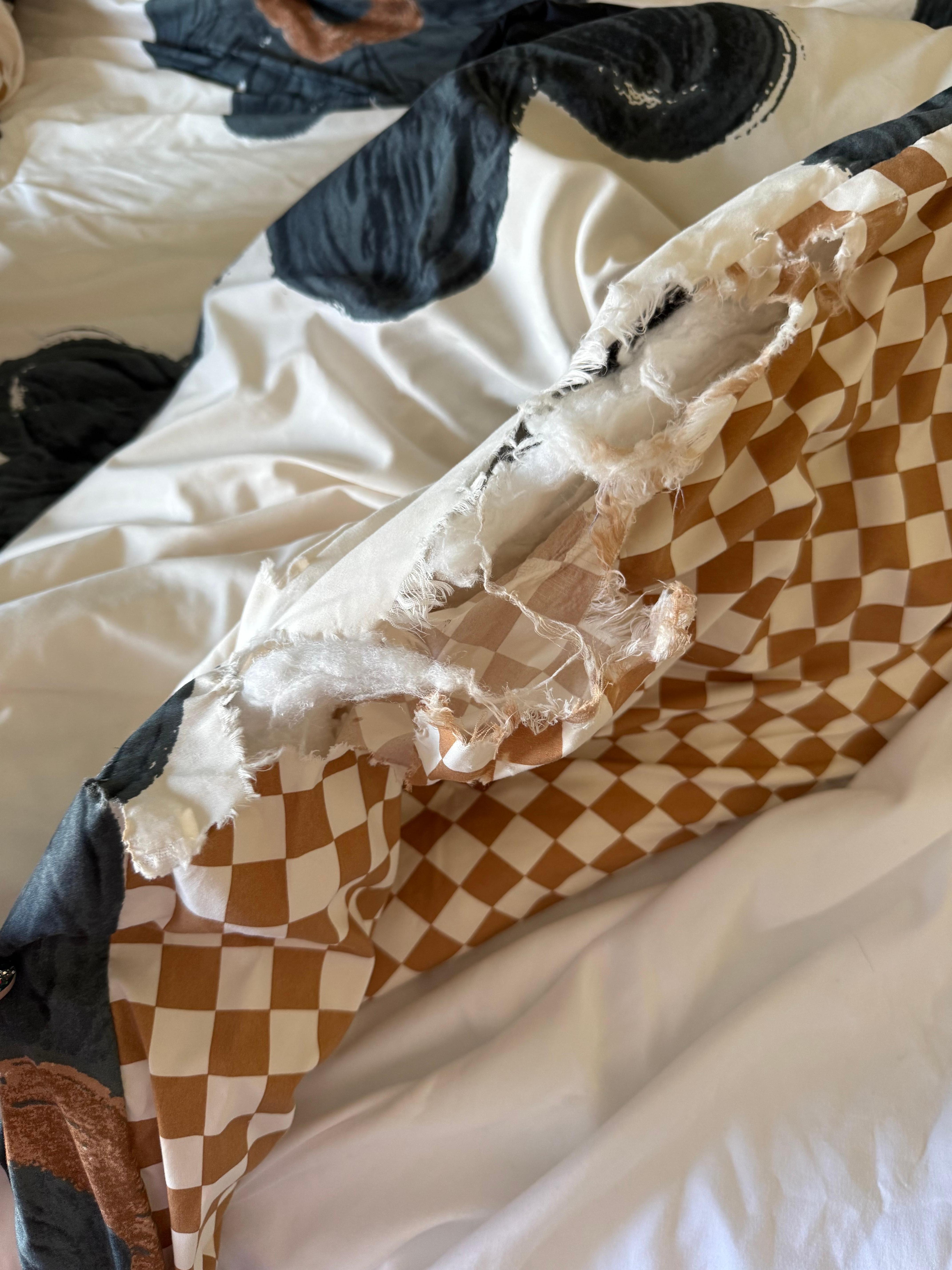 Comforter has a huge hole. The cleaners didn’t notice?