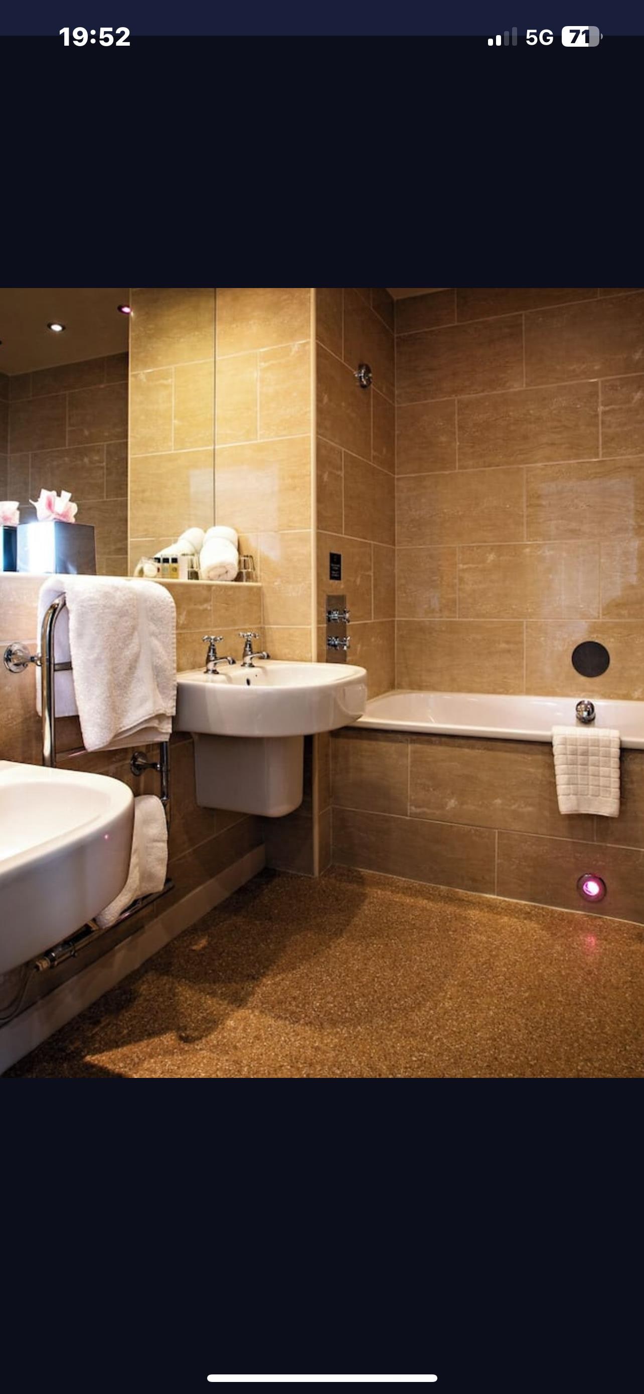 This is what was advertised instead we got above screwed in bottle to wall that took a lot of pumping. 