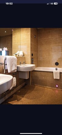 This is what was advertised instead we got above screwed in bottle to wall that took a lot of pumping.