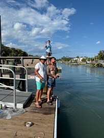 Enjoying some fishing from dock behind house