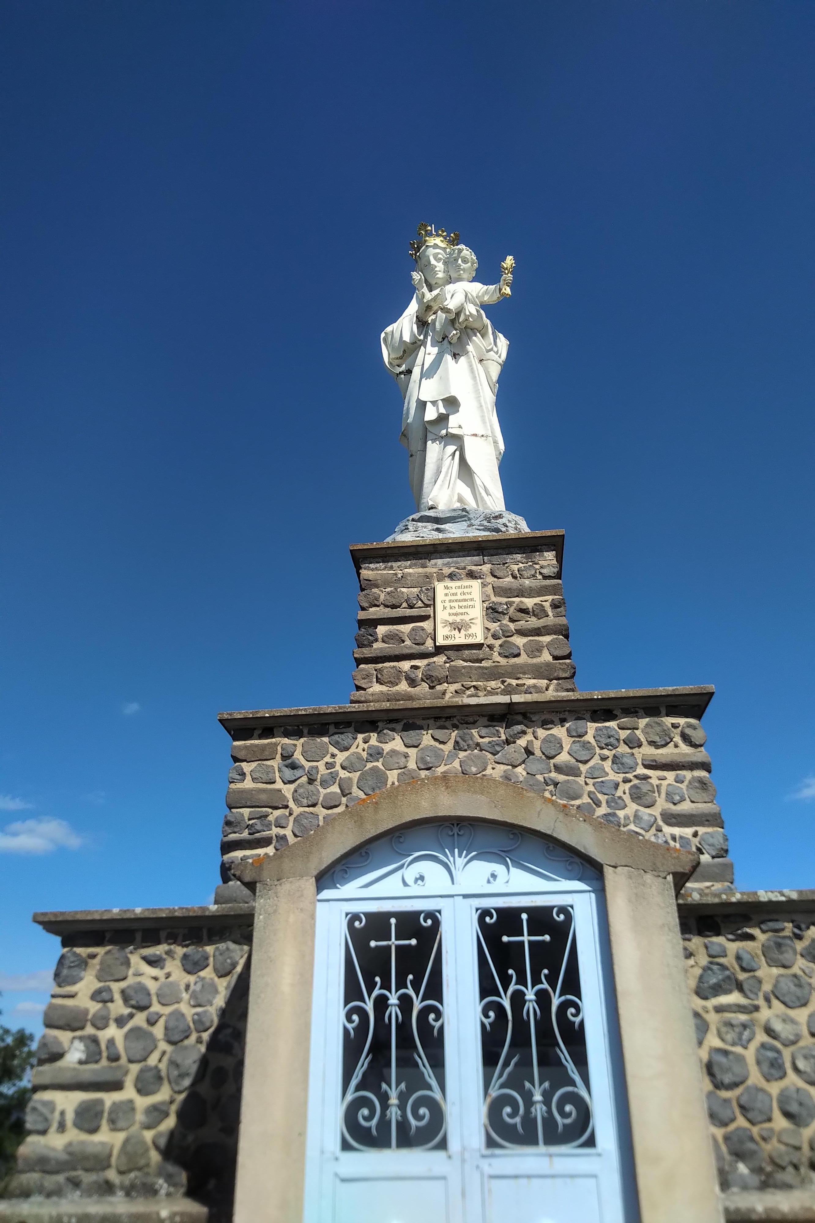 Virgin Mary statue at peak os Usson. 