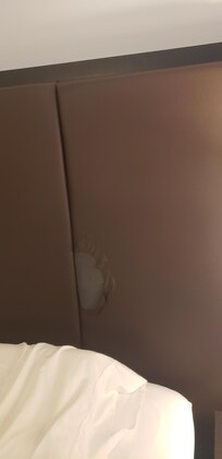 Leather peeled, hidden behind pillows