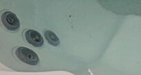 Hot tub- red mold and debris