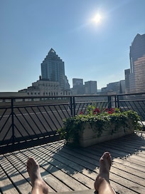 Rooftop patio with loungers beside the indoor pool and exercise room.