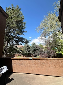 Second floor outdoor seating area with a view.