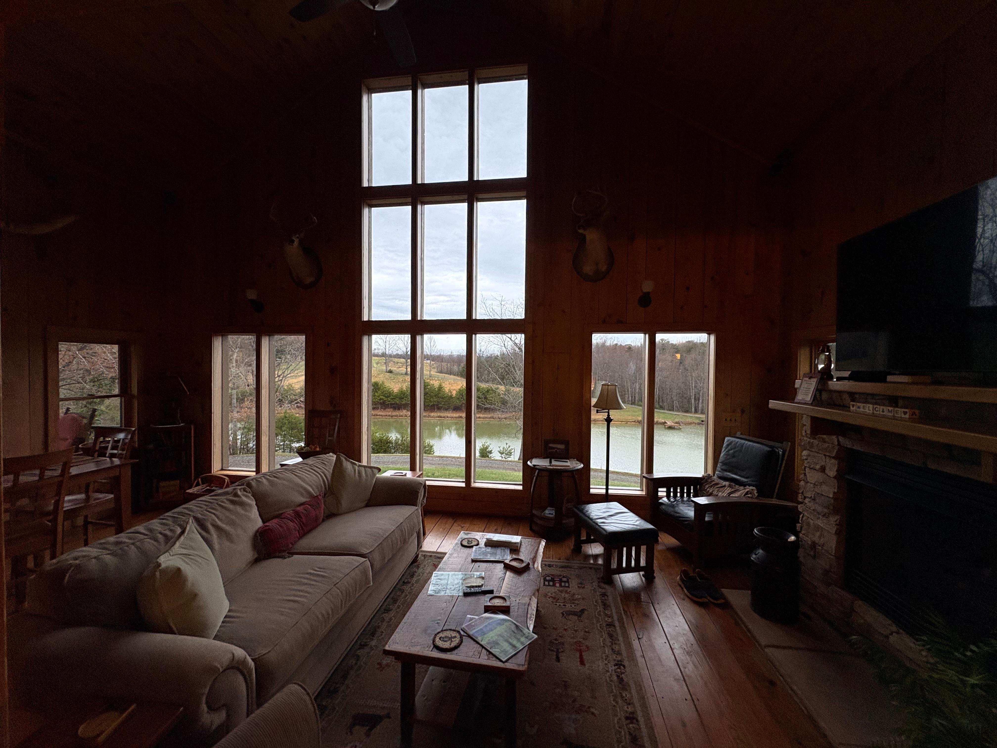 Huge windows overlooking the valley and pond. 