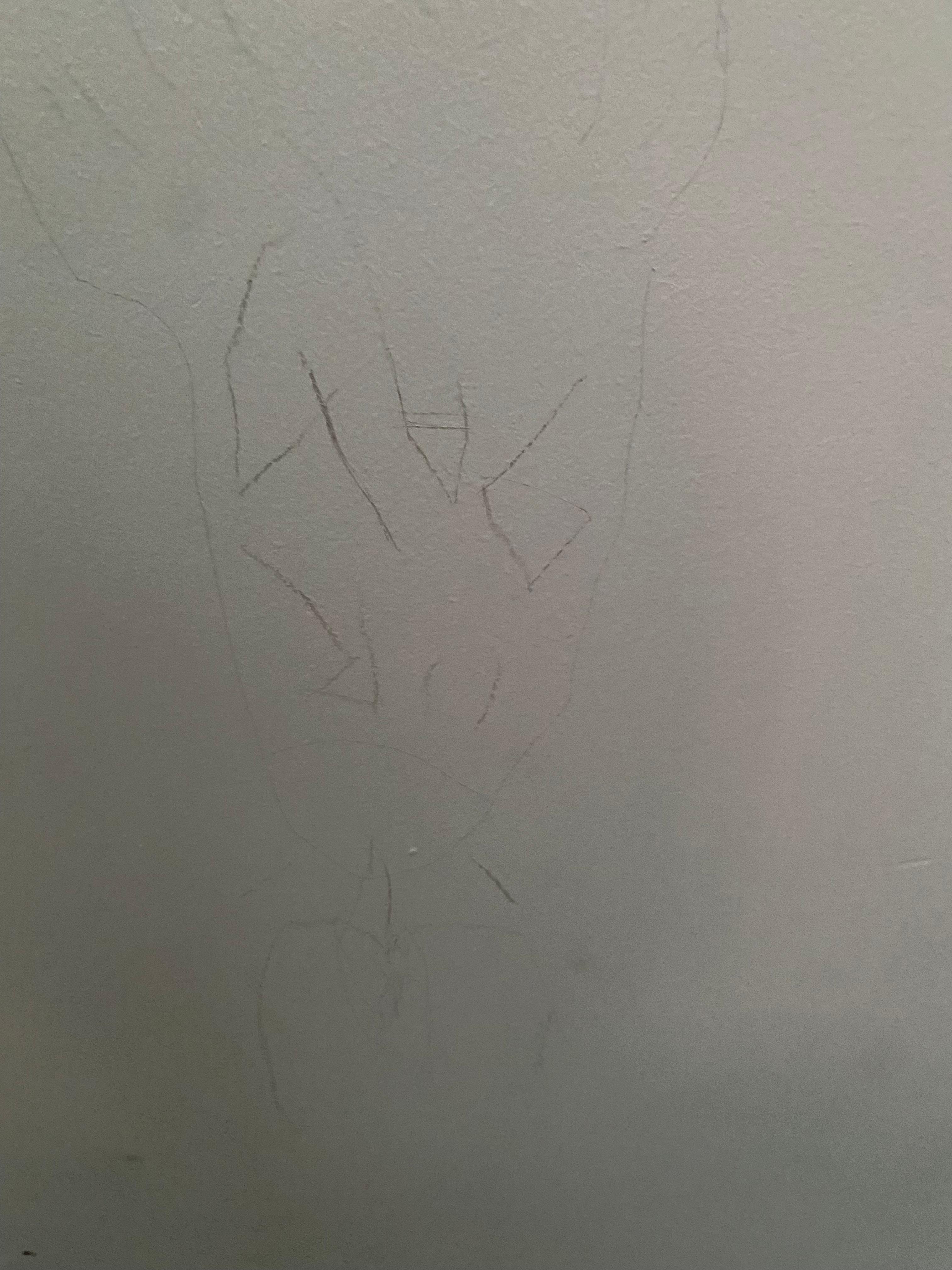 Writing above bed on ceiling