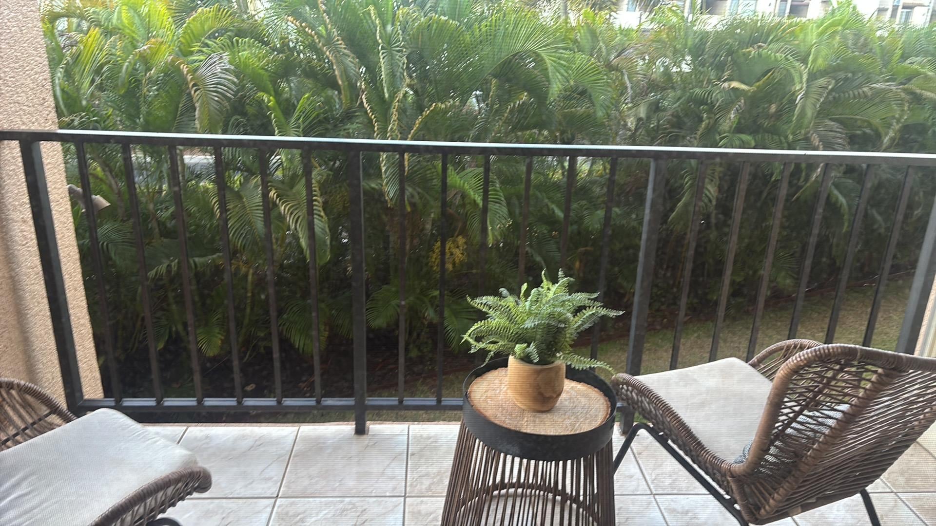 The patio, there are two seats and storage. 