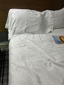 Slept fully clothed on a sheet.