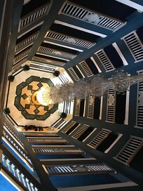 View of magnificent interior decor with center chandelier.