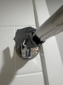 Shower rod held up with duck tape