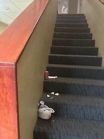 Open beer can and trash