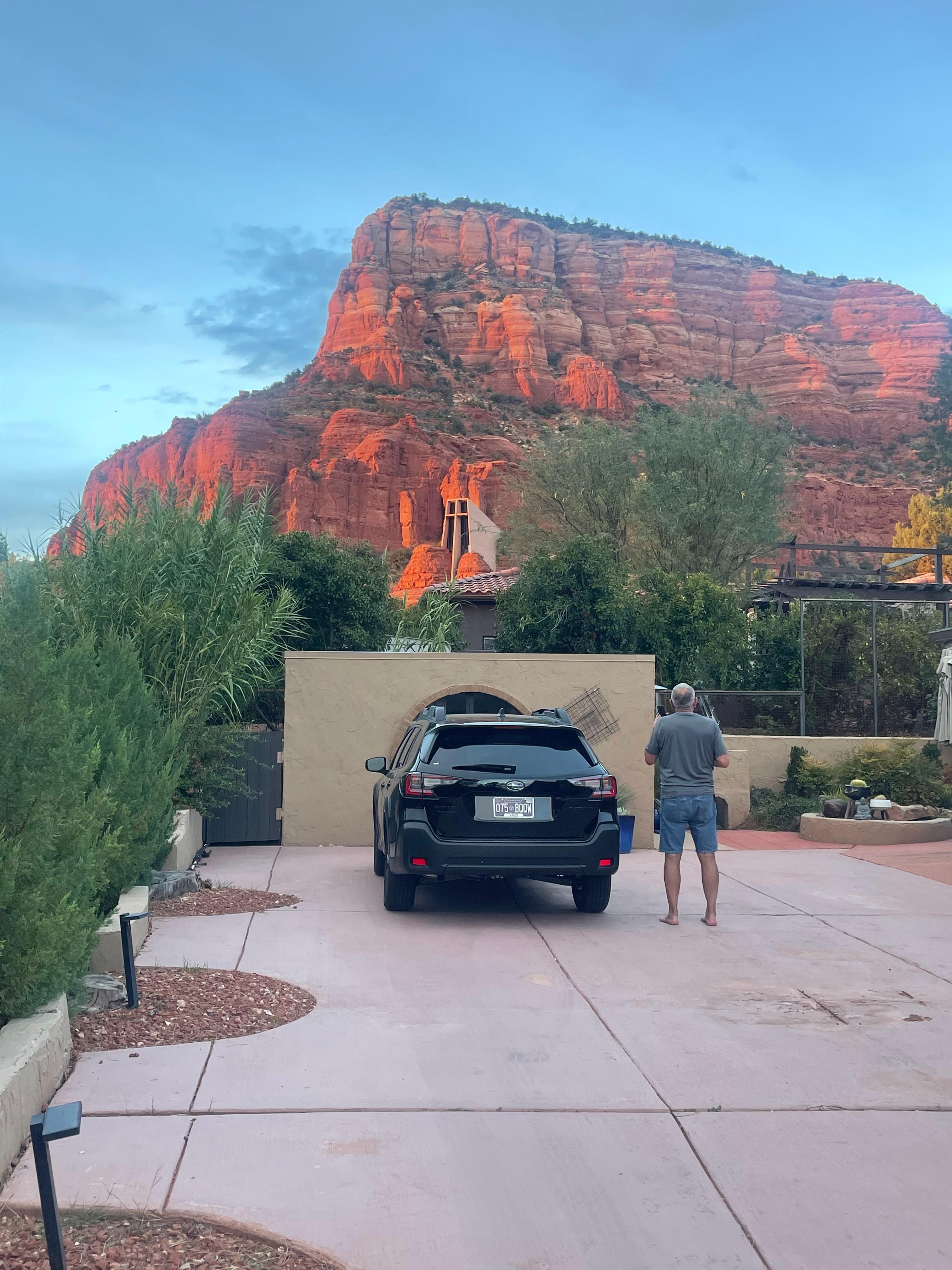 Our car & my husband in the driveway, upon arrival. 