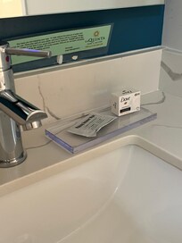 No amenities such as lotion, shower cap, etc. Had 1 small bar soap, 2 bath towels, and a hand towel.