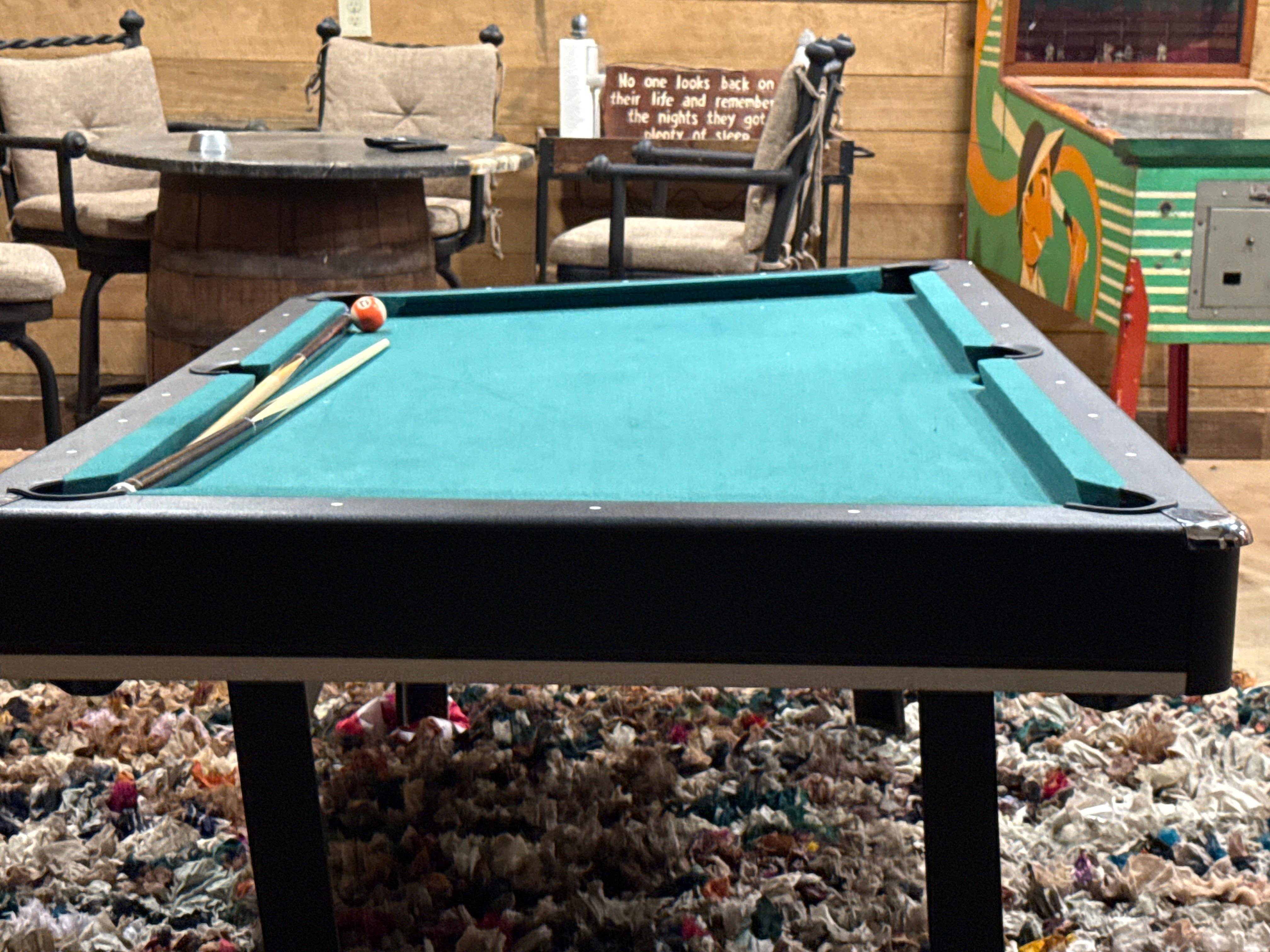 Broken pool table. No one fixed; Broken arcade game.  Did not work.  