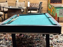 Broken pool table. No one fixed; Broken arcade game.  Did not work.