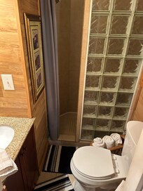 The shower entrance is very narrow. The bathroom is very small.