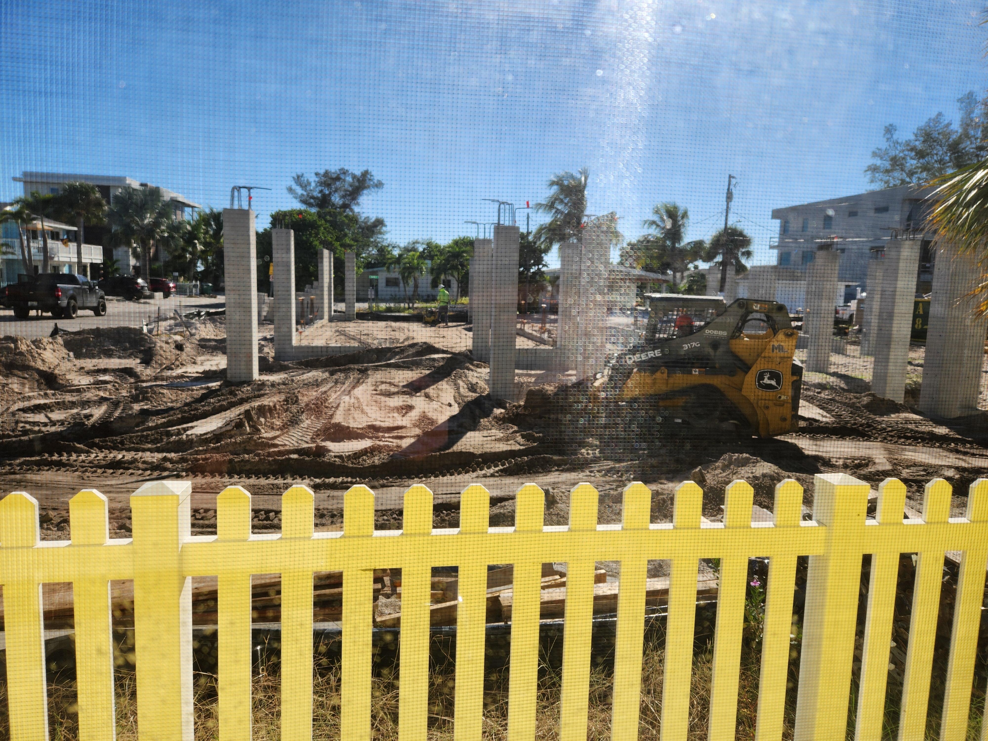 Kitchen window view. Skidsteer backup alarm nonstop during our stay. 