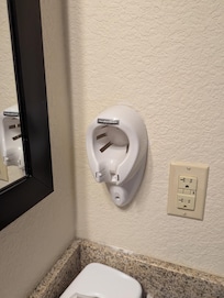 No hair dryer. Dry wall debris on counter