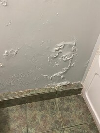 Condition of the wall in the bathroom.