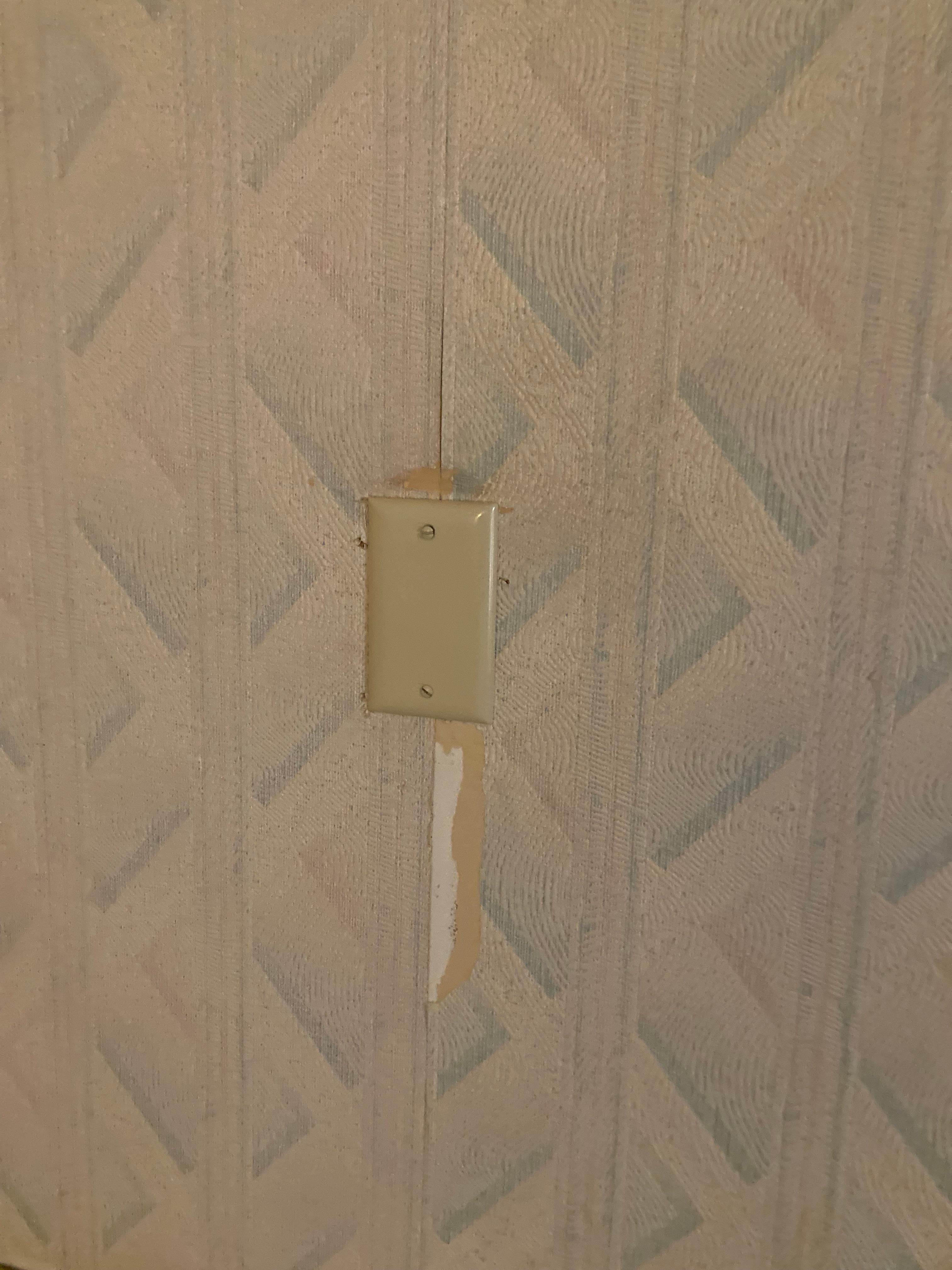 Wall paper ripped out coming off in multiple places