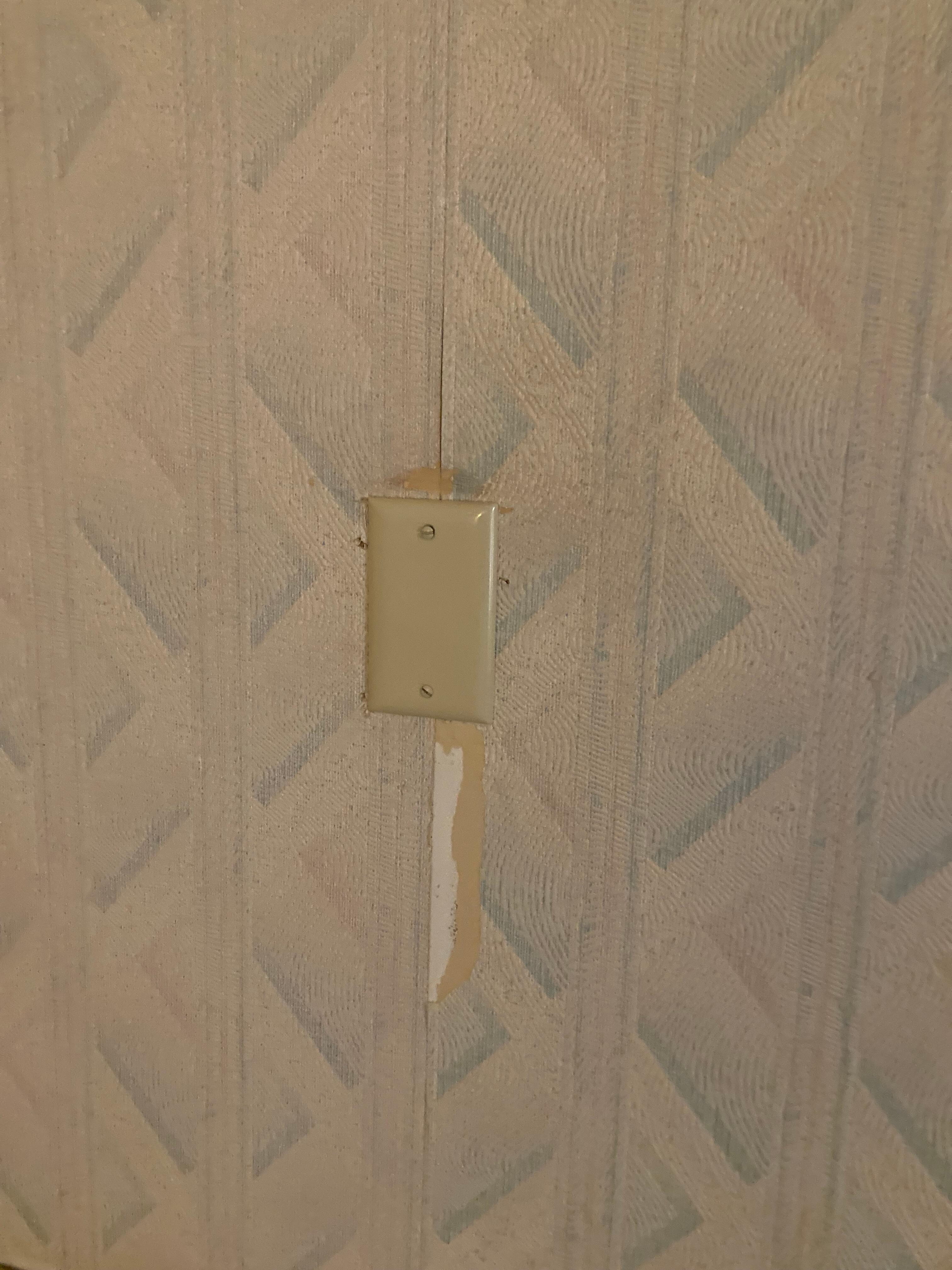 Wall paper ripped out coming off in multiple places