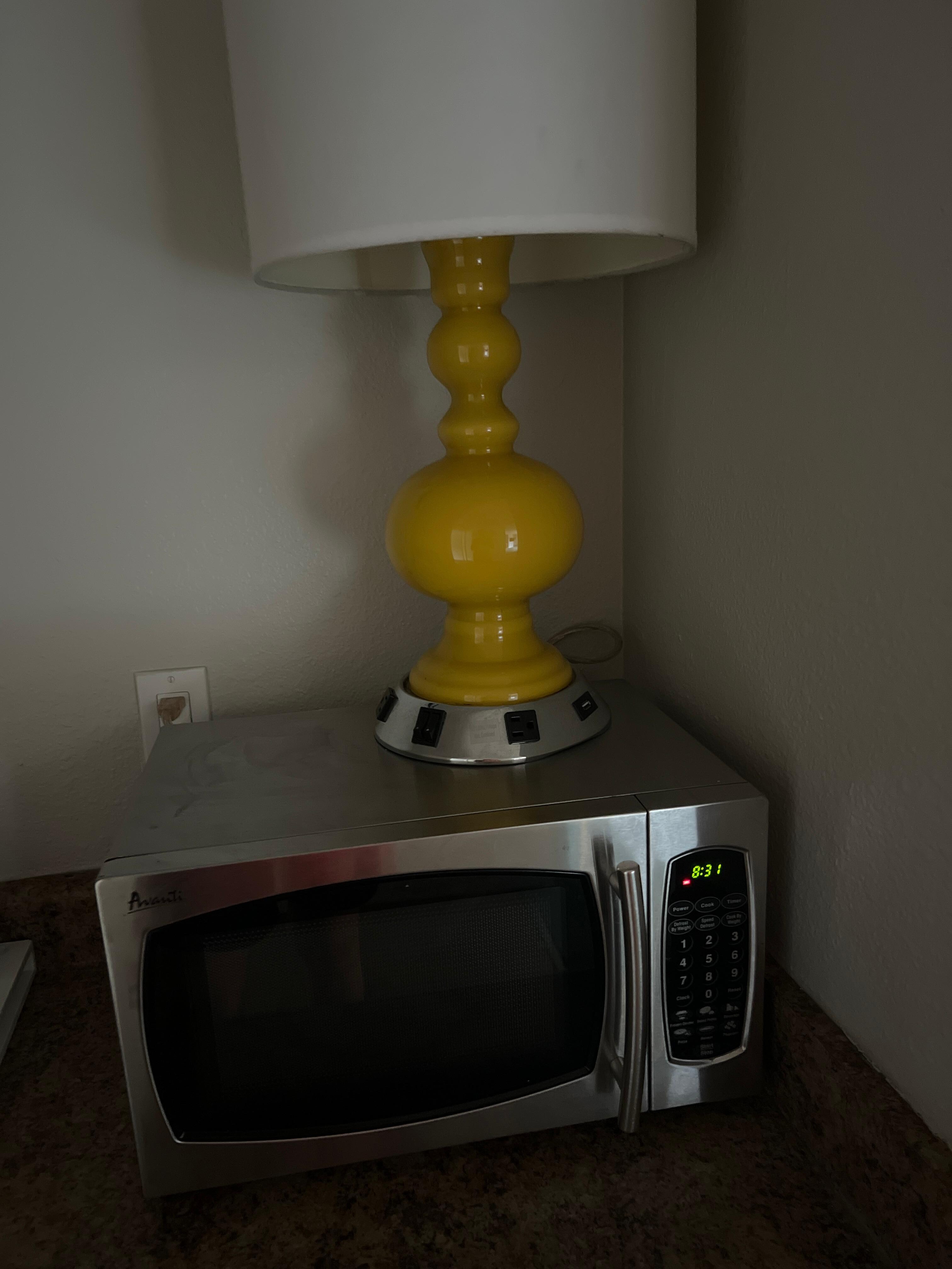 Old lamps on top of microwave 