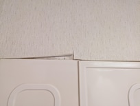 Wallpaper in owner's suite bathroom was peeling off everywhere.