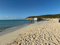 Beautiful palm edged beach within a few minutes walk.