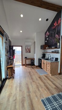 View of entry. Table has 3 folding chairs, folds down to save space.