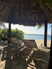 Private beach hut and sun loungers