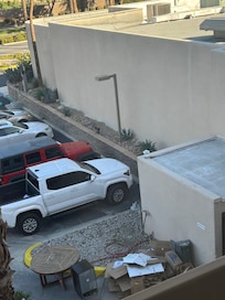 View from our room of broken boxes, broken frig, cars