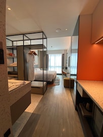The hotel room is clean and modern.