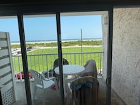 Spacious balcony with table and 4 chairs