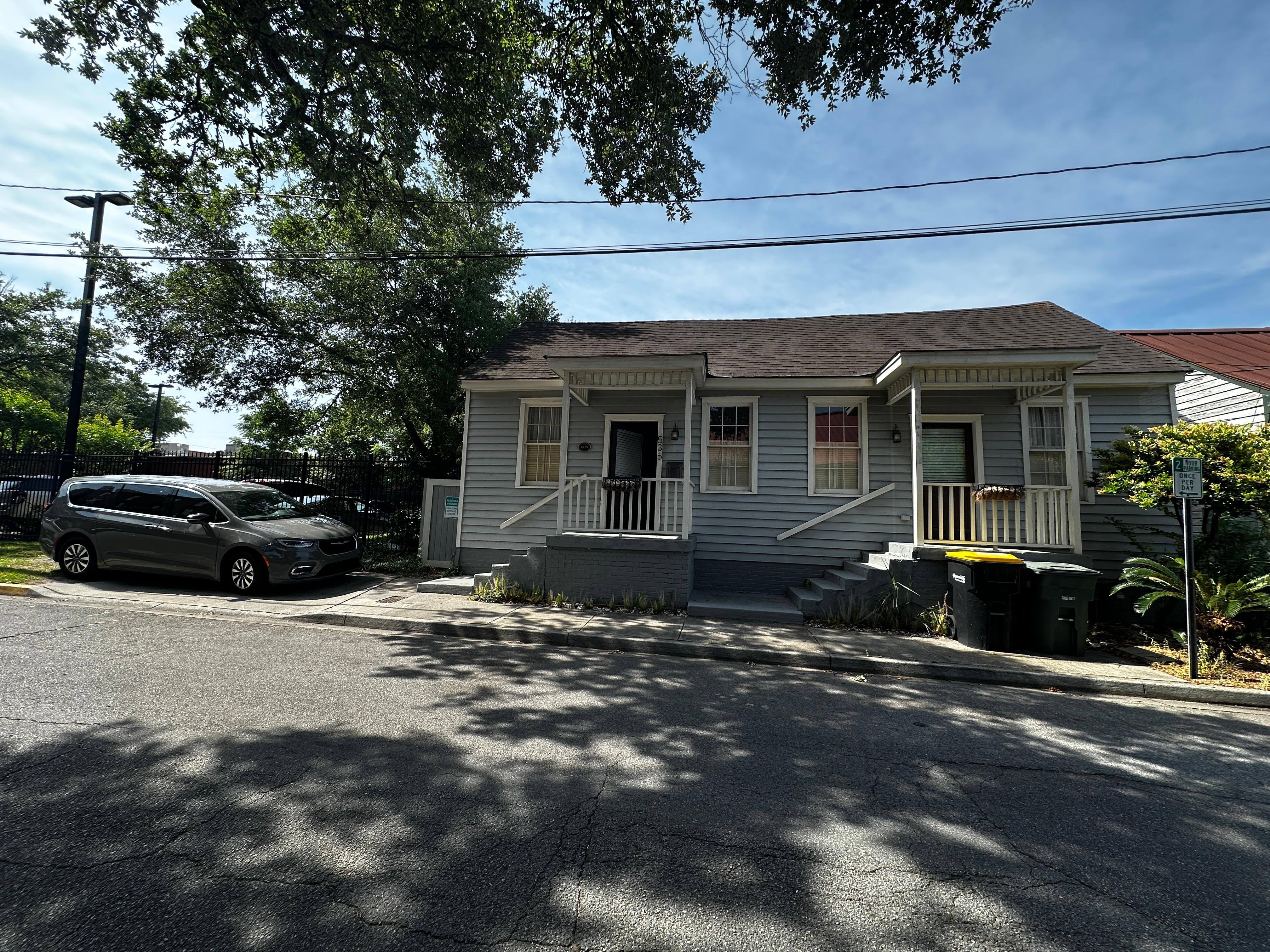 Front of house with van parked 