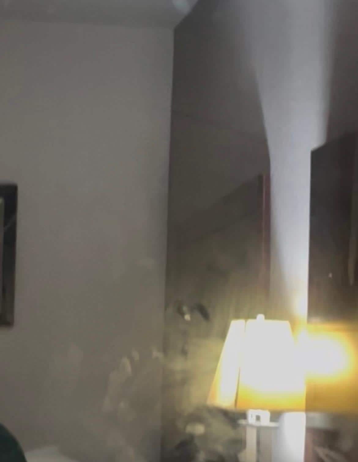 Mirror covered in dust and hand prints 