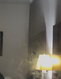 Mirror covered in dust and hand prints