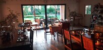 Salle déjeuner trÚs accueillante avec les propriétaires