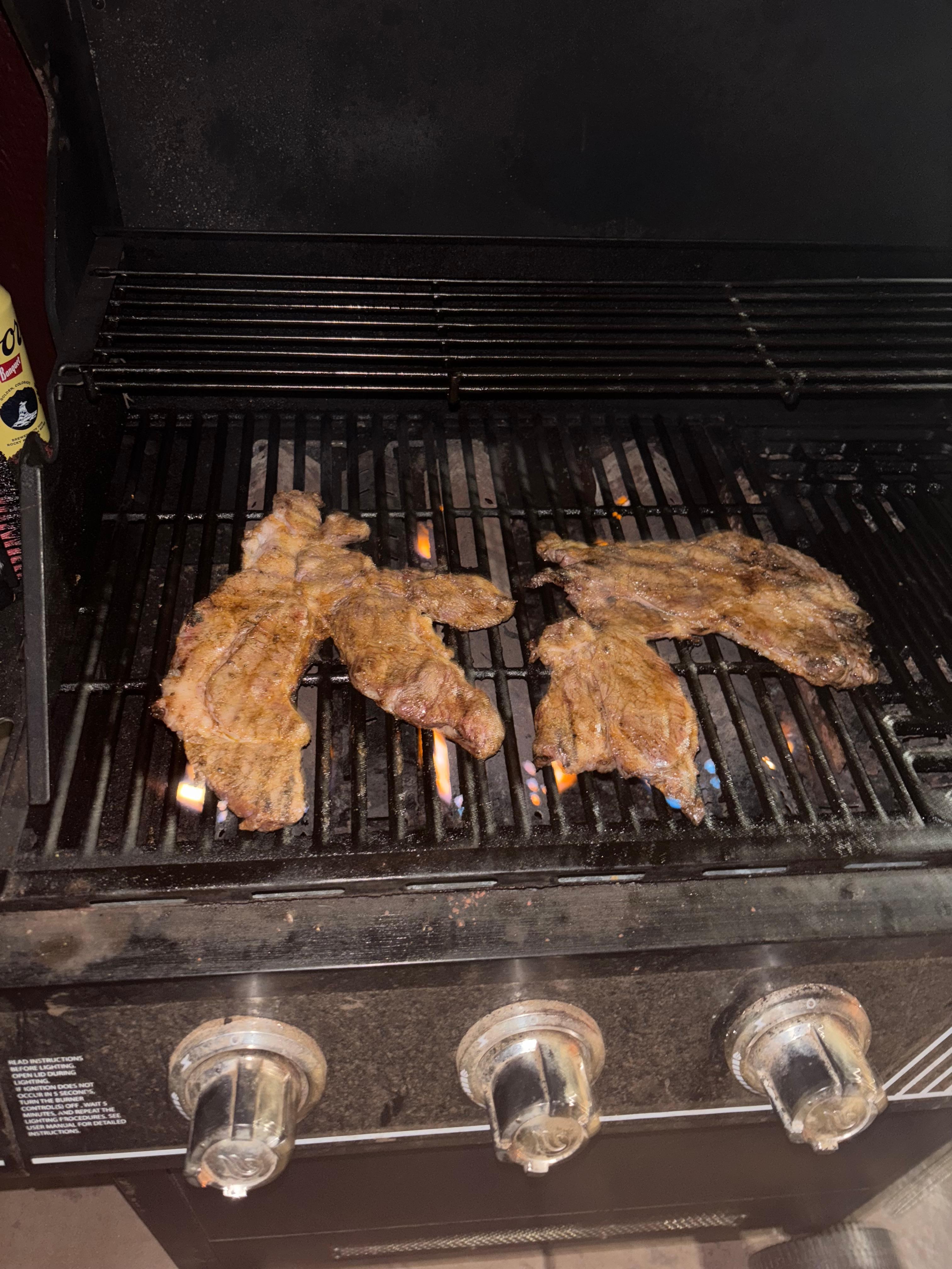 Grilling steak on the grill 