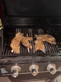 Grilling steak on the grill