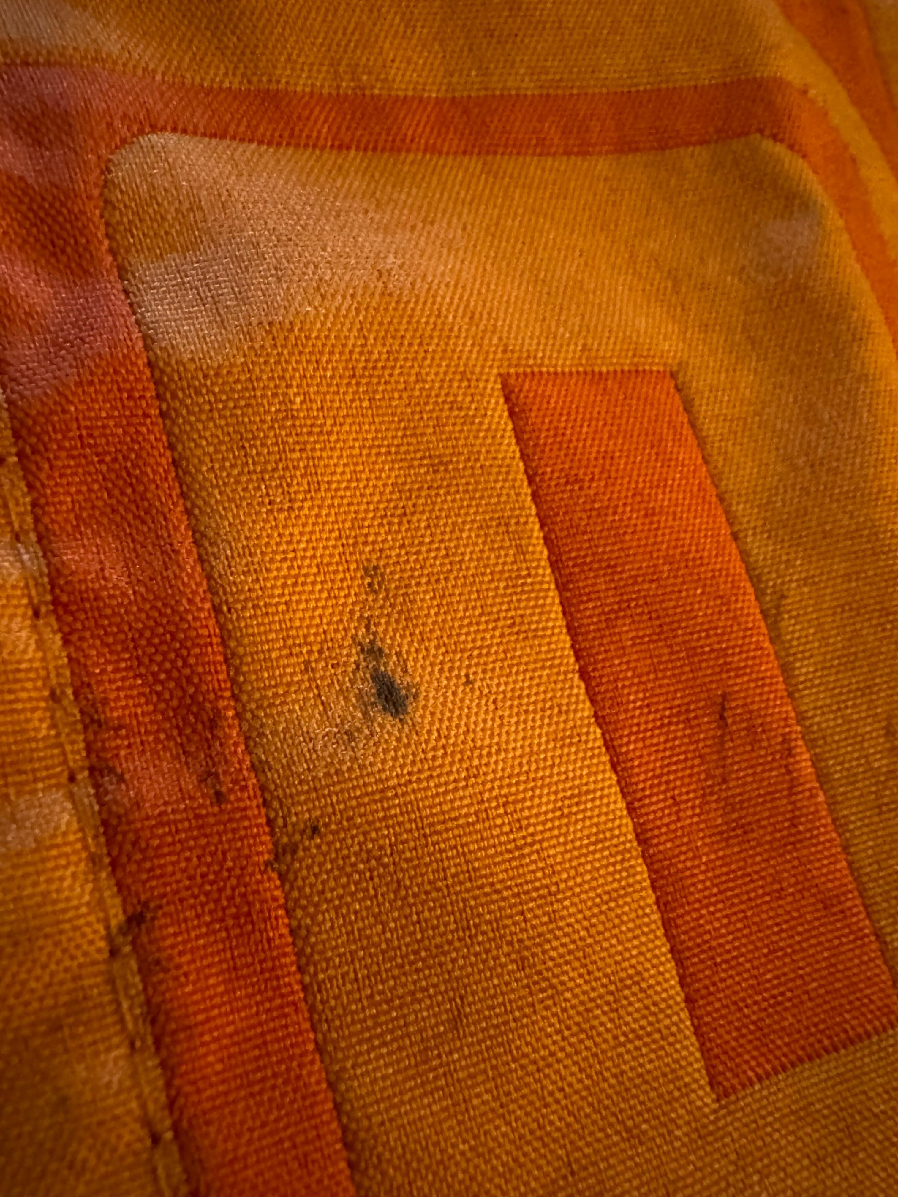The very top of the bed, the little cover runner that’s at the bottom of the bed (on top of the cover) 