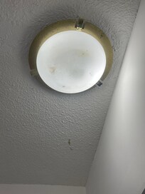 Dirty light fixture in bathroom