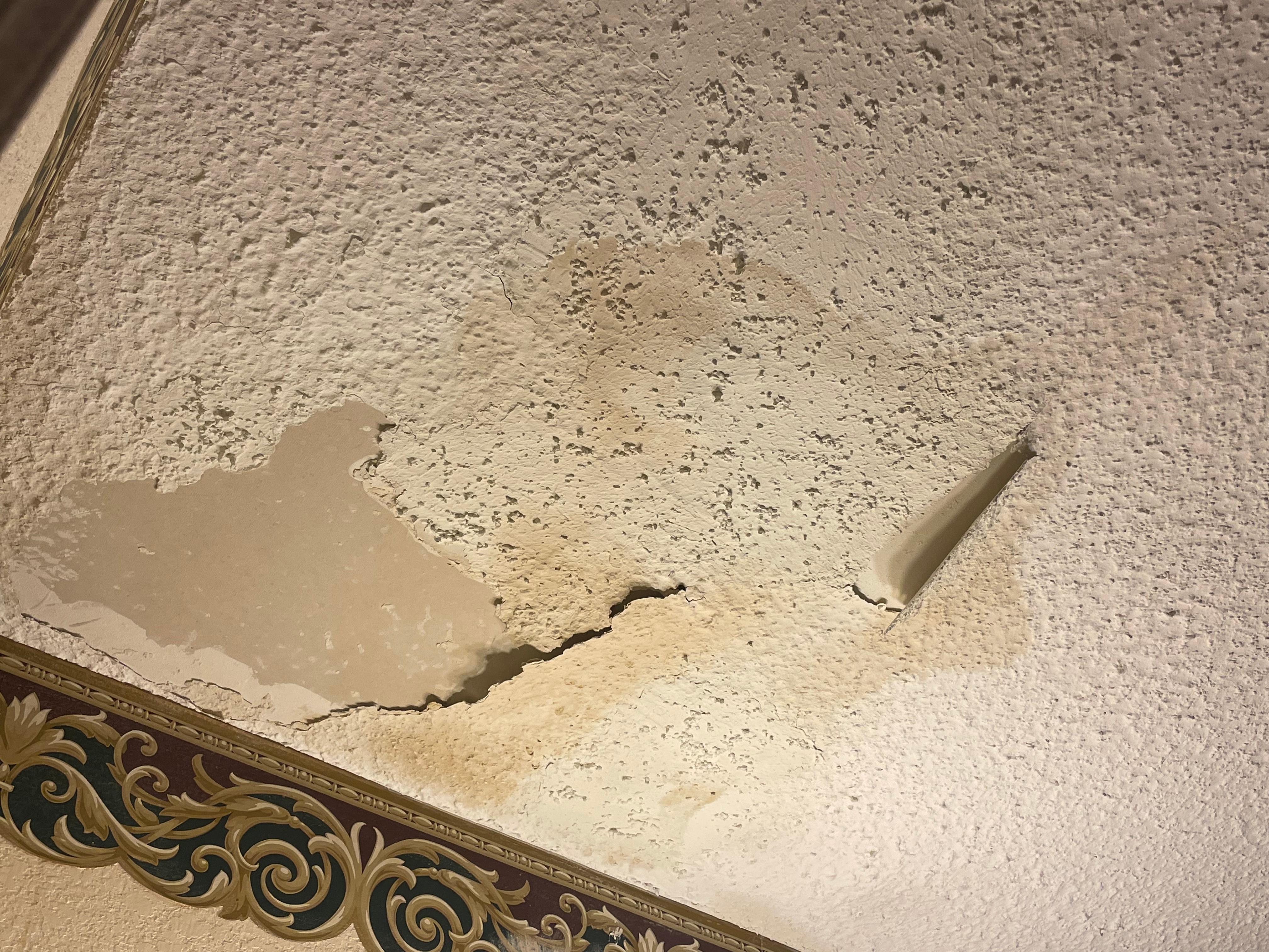 Water damage and peeling plaster