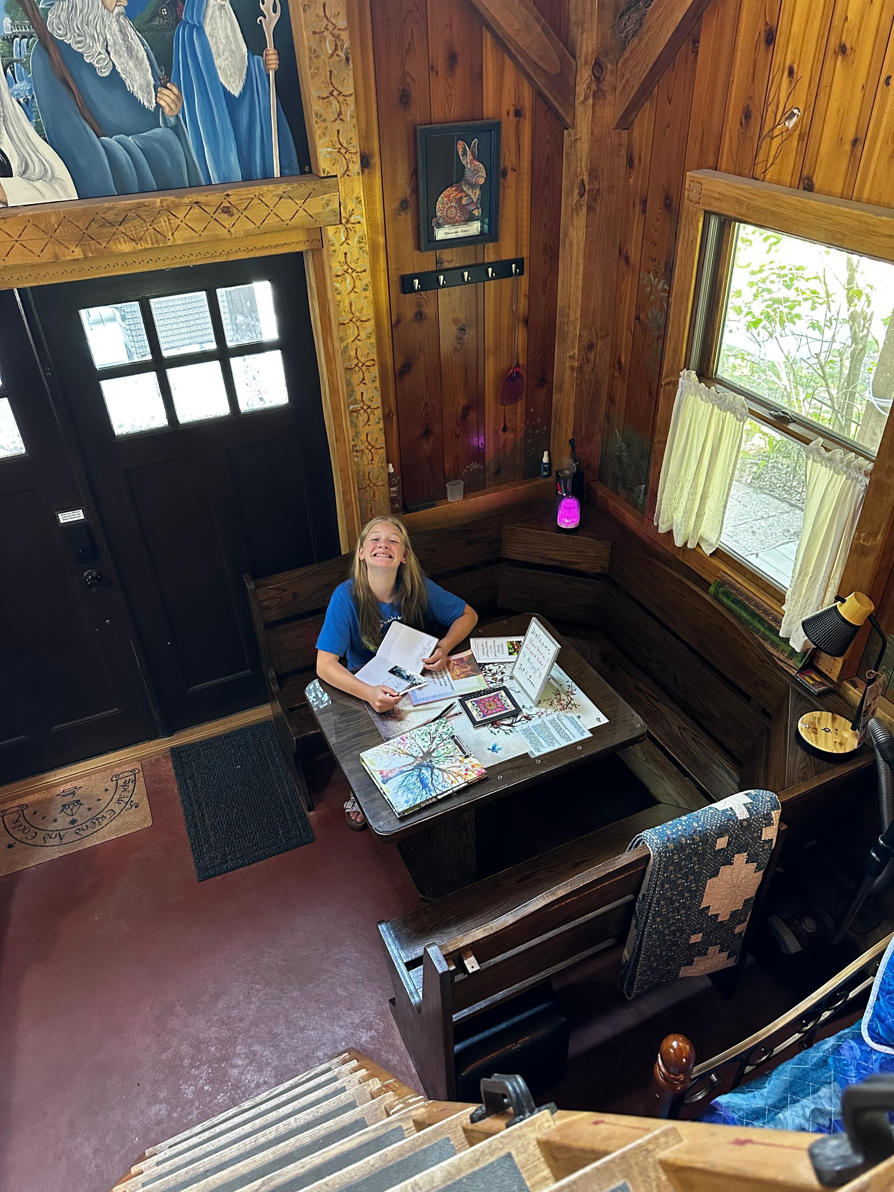 Granddaughter enjoying sitting in the booth looking at the info they have for you to read! 