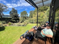 Relaxing on our private deck (private hot tub is around the corner)