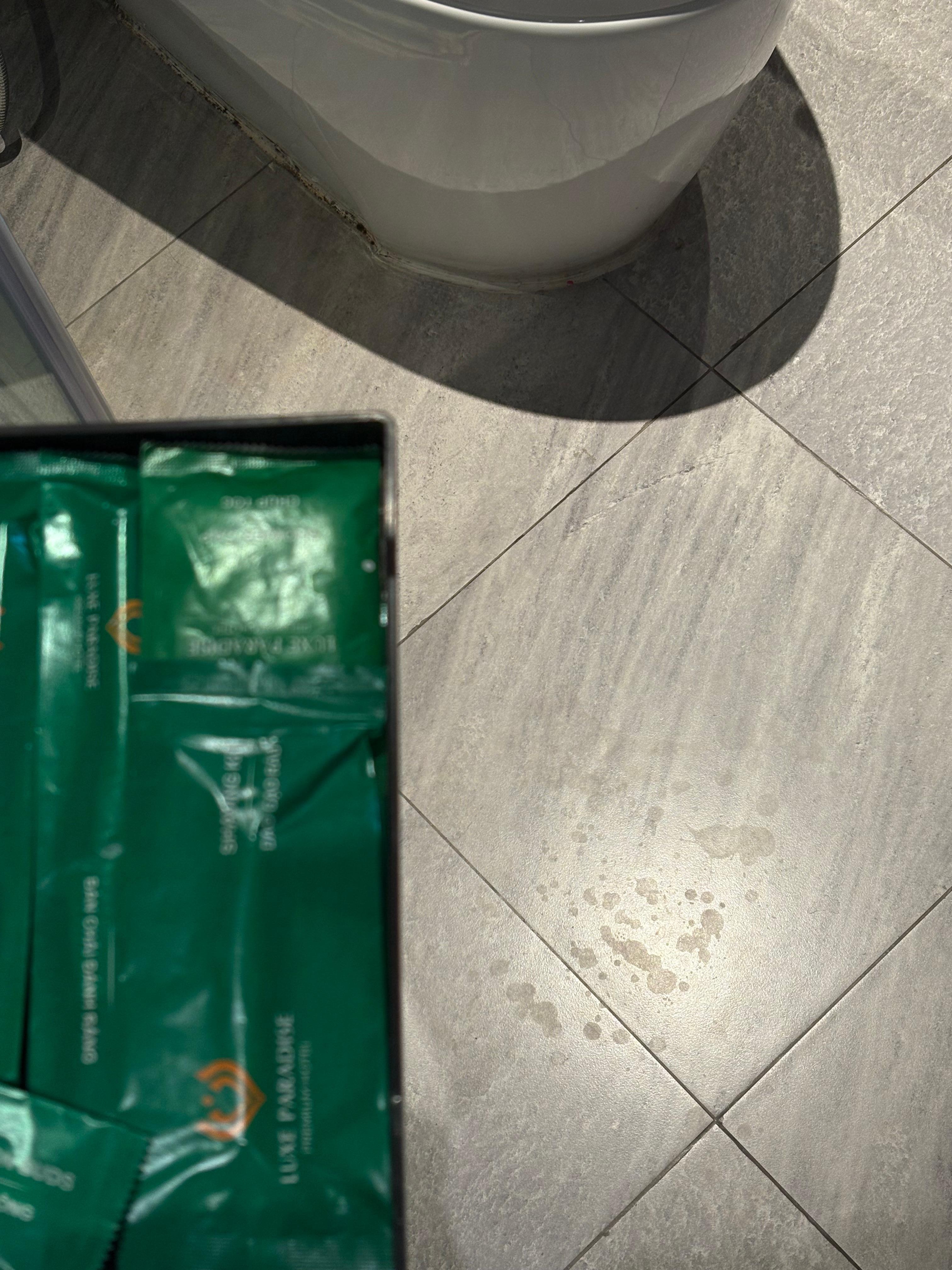 Permanent stains on the bathroom floor room 607