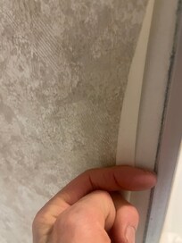 wall paper in the bathroom coming off everywhere