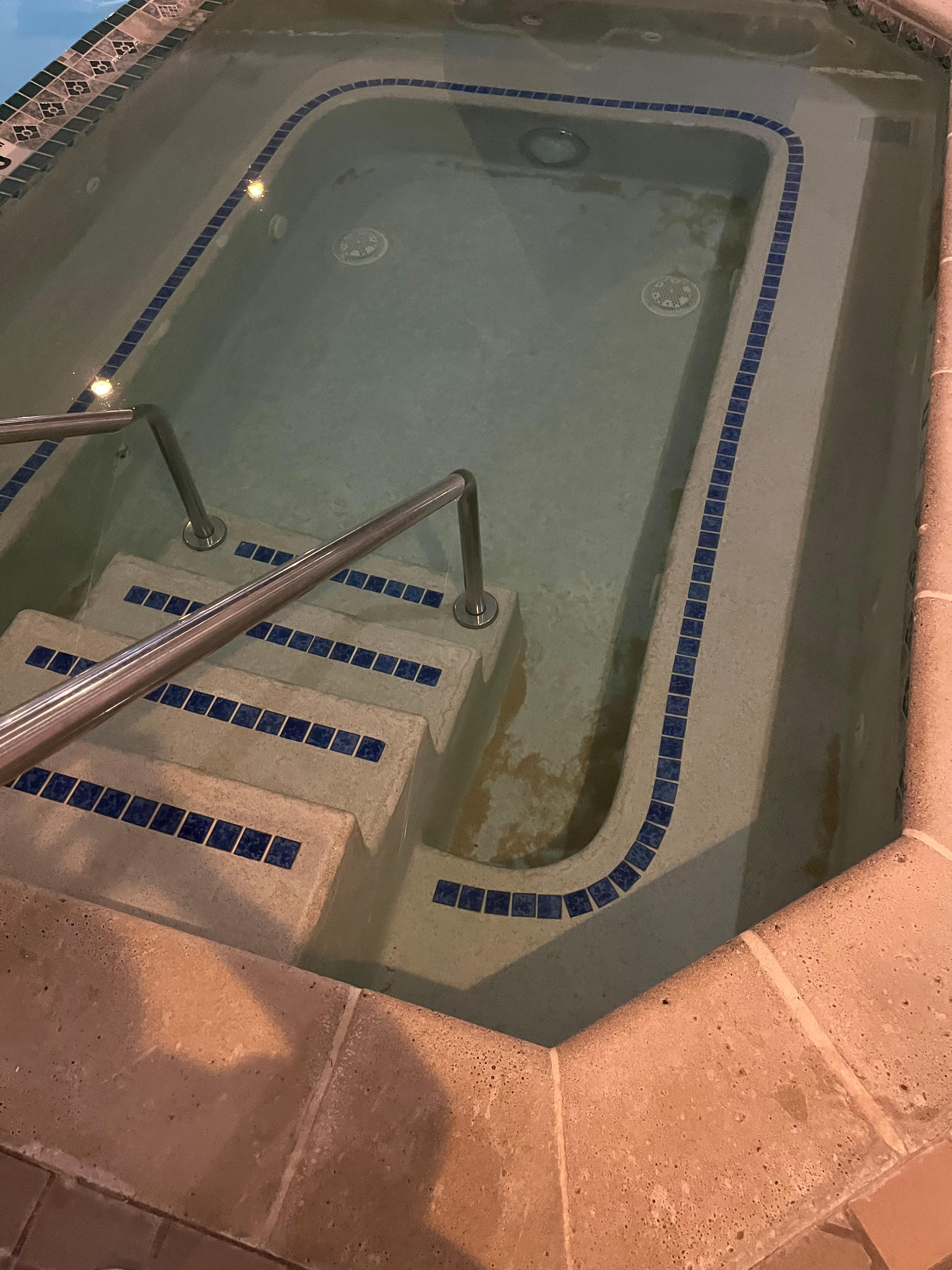 Dirt and sand at bottom of hot tub