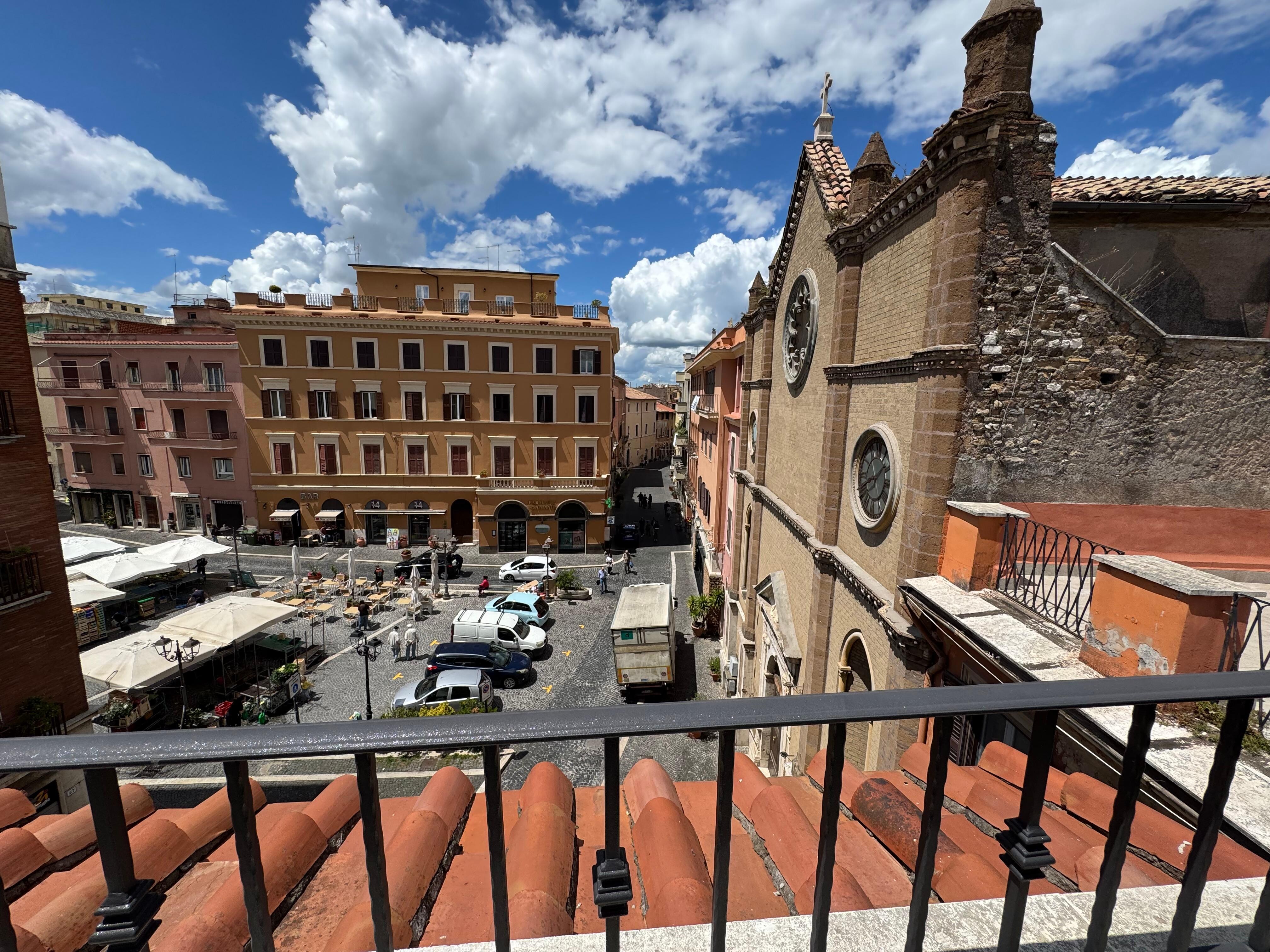 View from rooftop patio.  Church on right and Piazza on left.  The church bells sounded like Italy. 