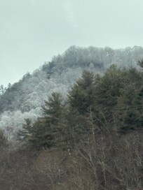 Surrounding snow covered mountains.